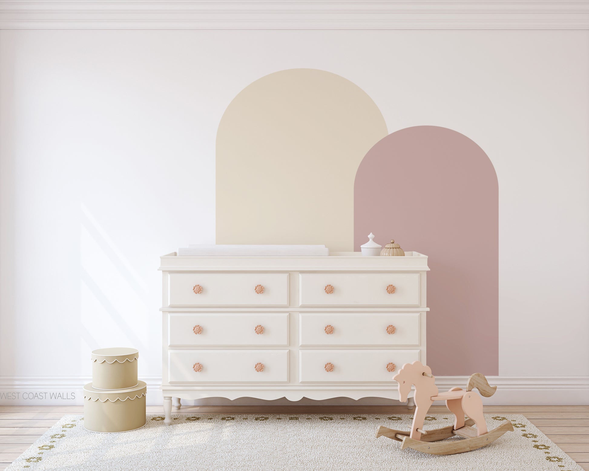 a baby's room with a rocking horse and a dresser