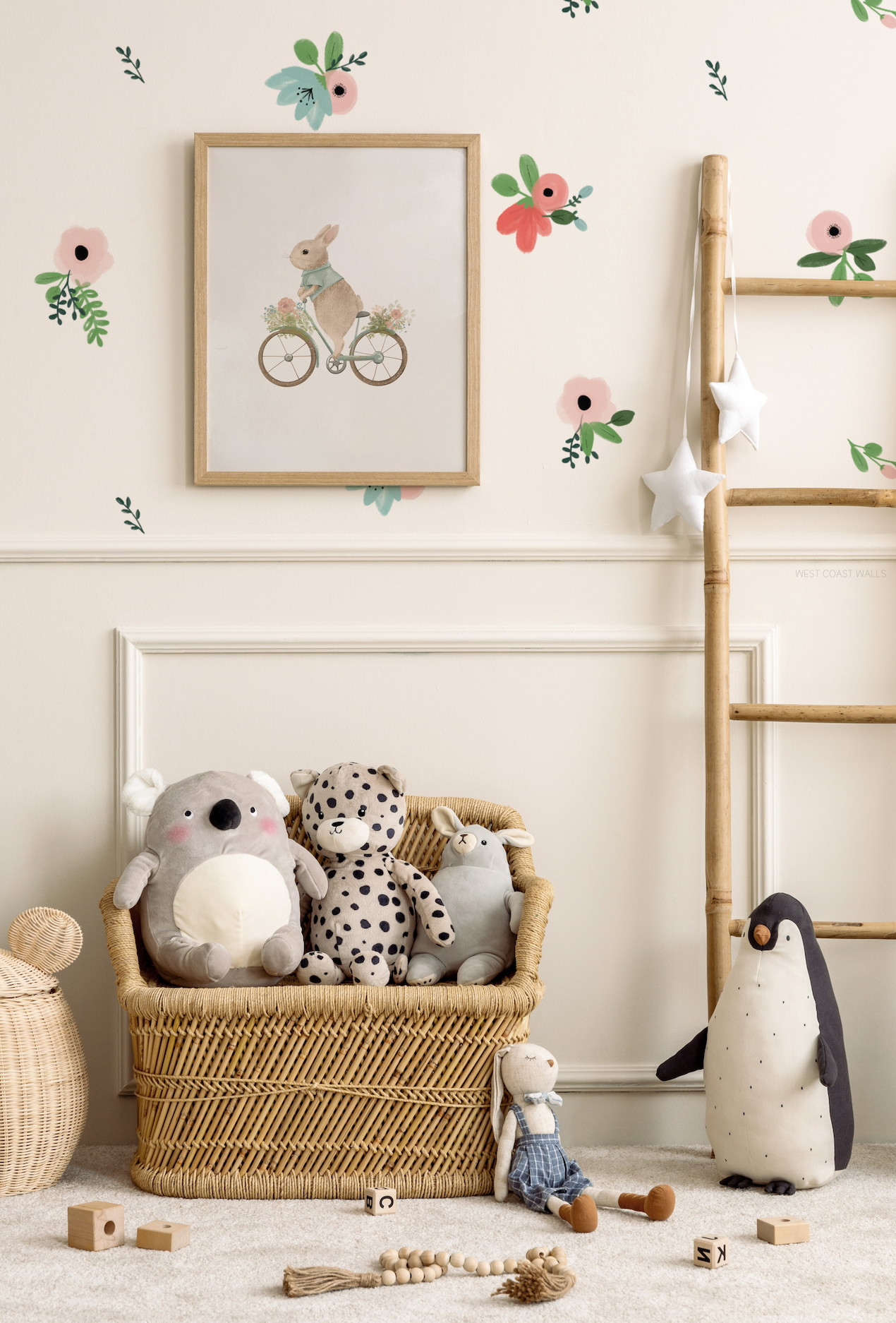 a basket of stuffed animals next to a ladder