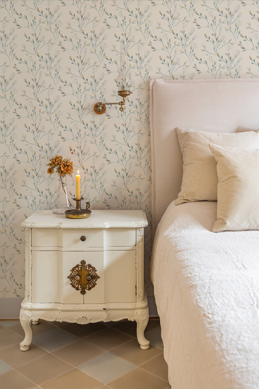 a white bed sitting next to a white dresser