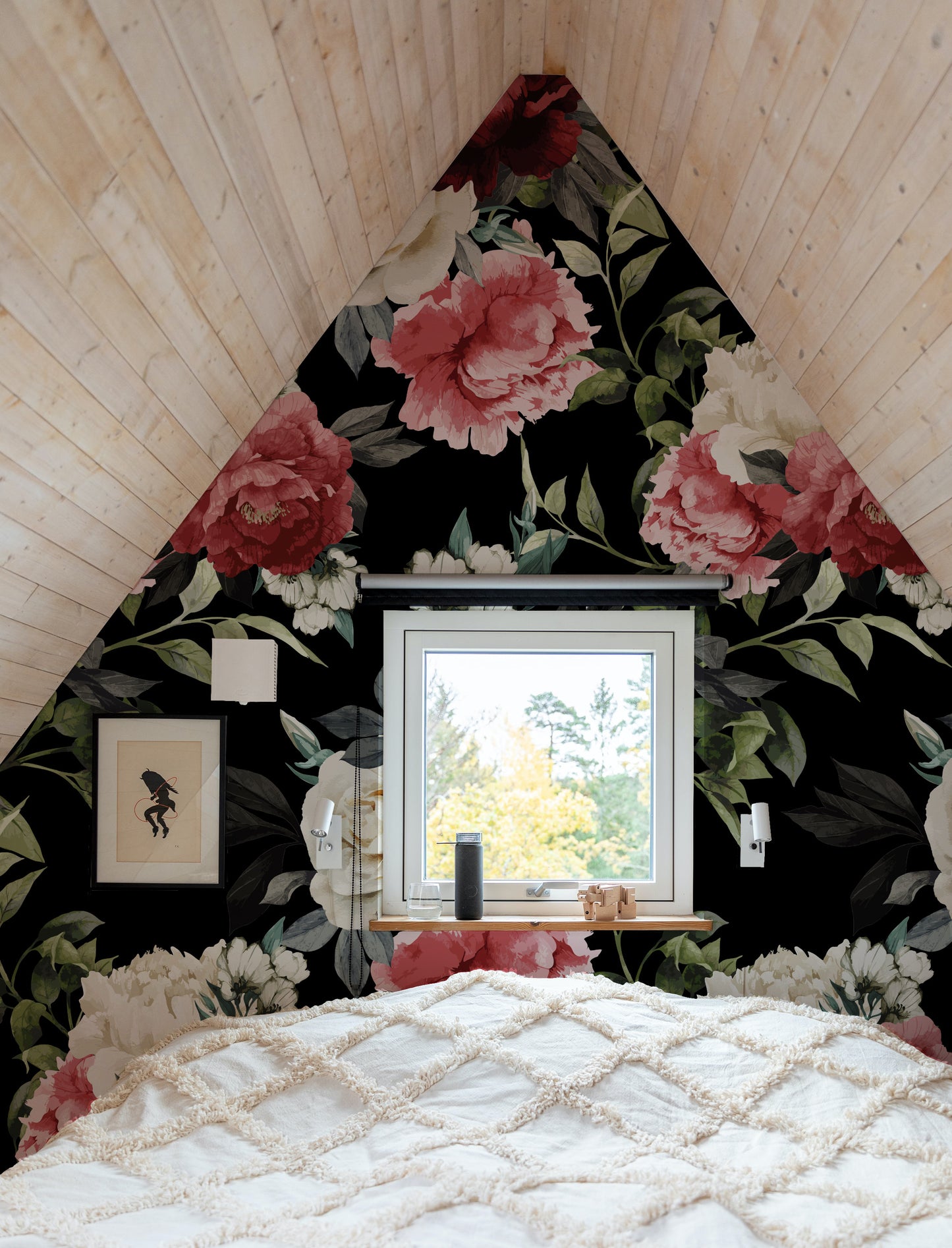 a bedroom with a floral wallpaper and a window
