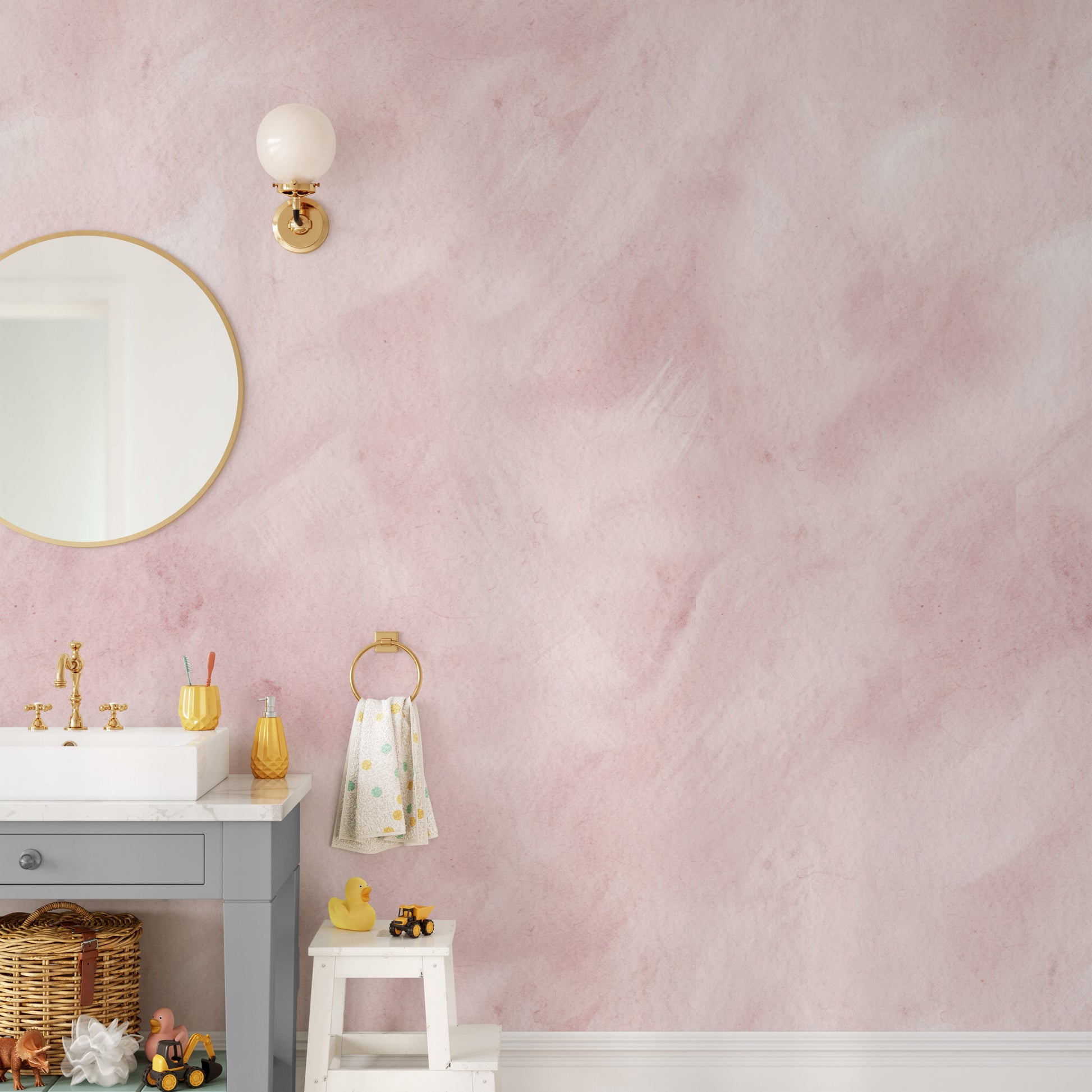 a bathroom with a pink wall and a mirror