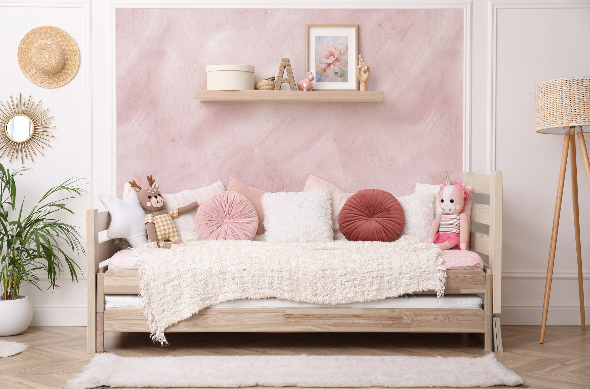 a living room with pink walls and a white couch