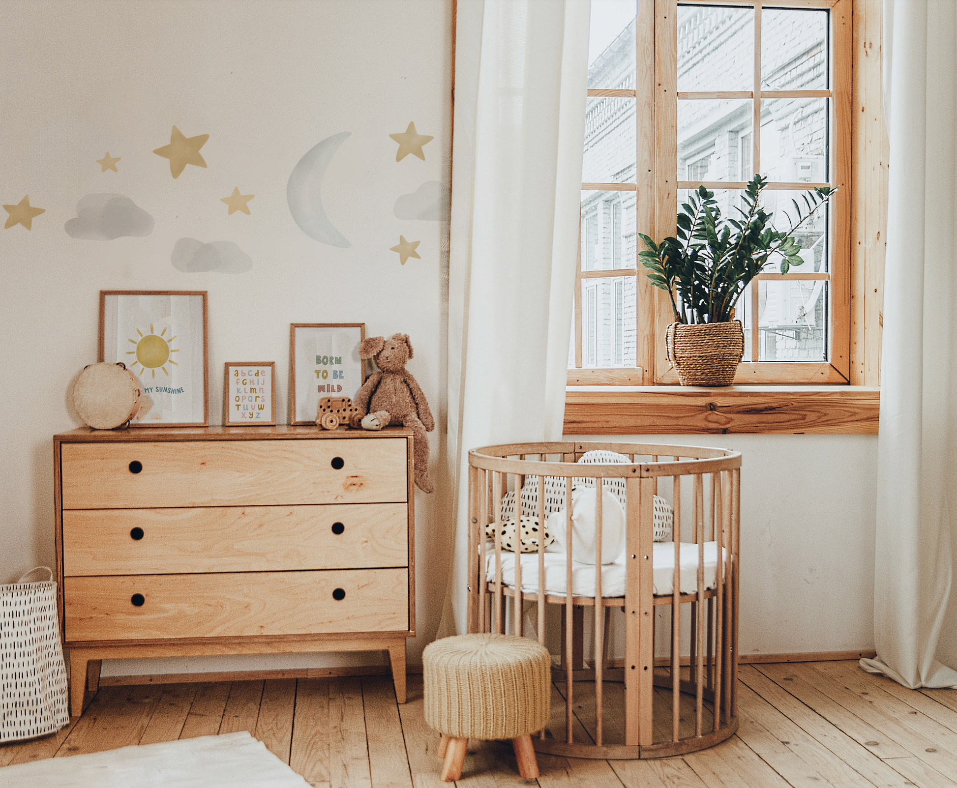 a baby's room with a crib, dresser, and window
