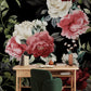 a desk with a chair and a flower wallpaper